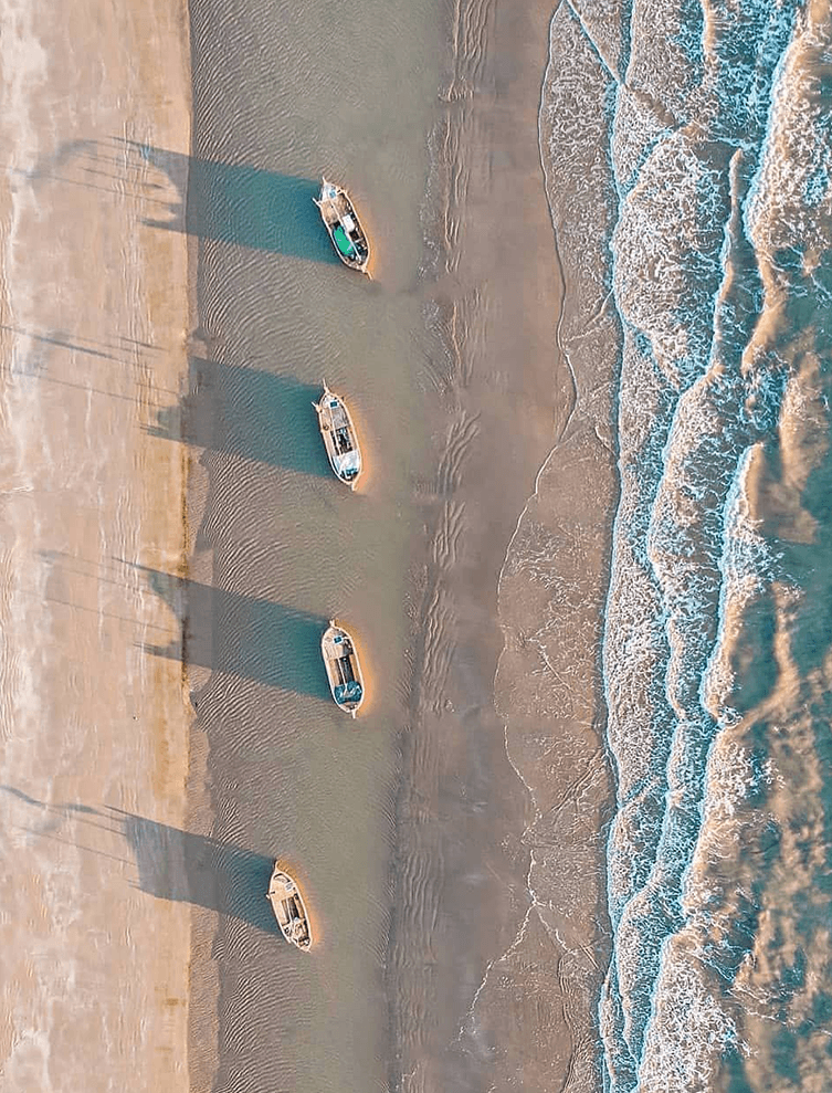 Aerial view of fishing boats on the Mandvi shore